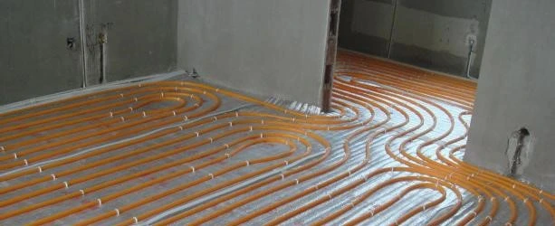 SPC rigid core vinyl flooring installed over underfloor heating system with thermal imaging showing even heat distribution through stone polymer composite planks and low thermal resistance underlayment SPC rigid core vinyl flooring installed over underfloor heating system with thermal imaging showing even heat distribution through stone polymer composite planks and low thermal resistance underlayment